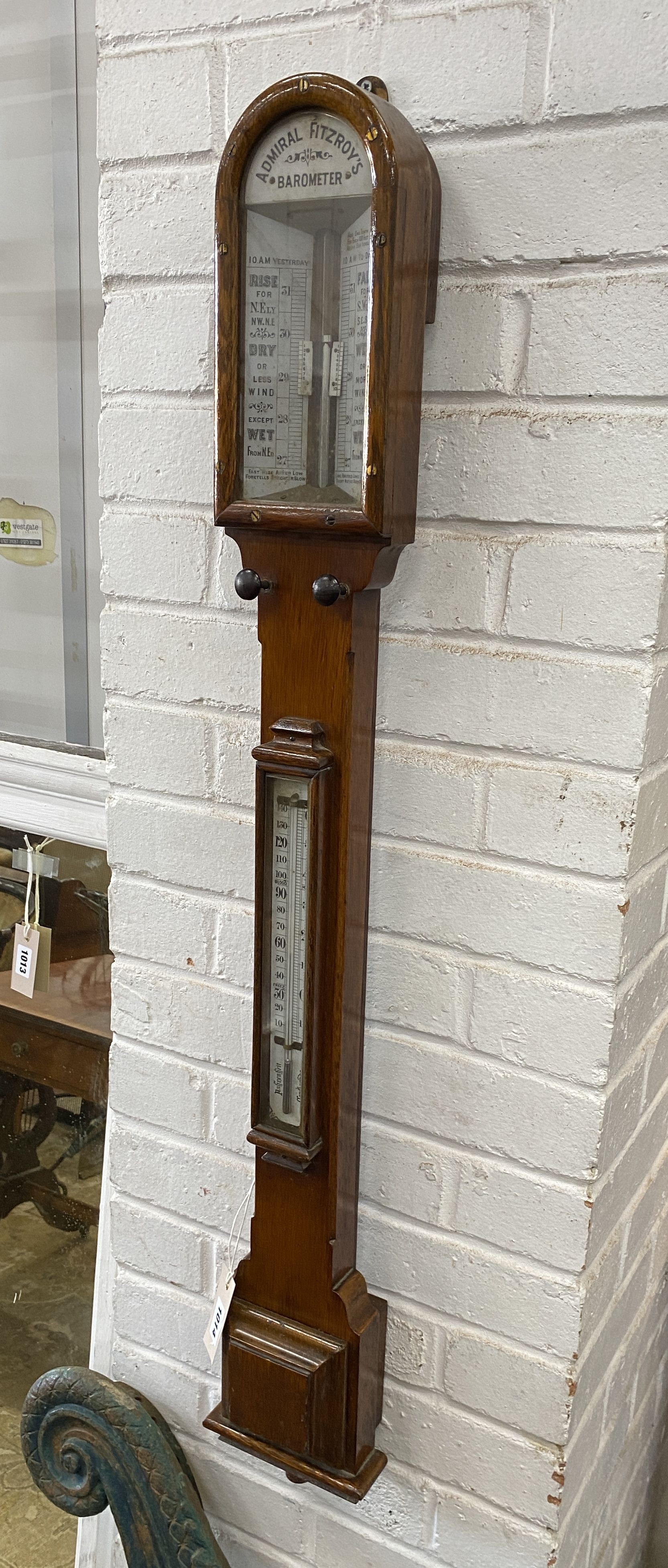 A Victorian oak cased Admiral Fitzroy’s stick barometer and thermometer, height 102cm